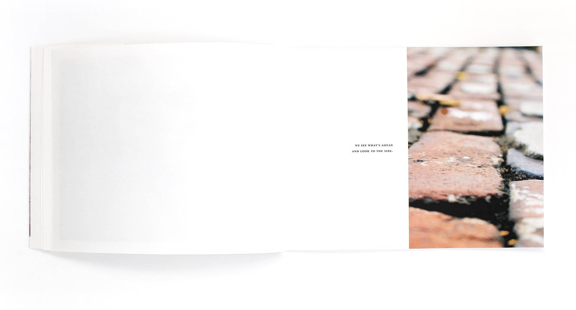Book Spread with image of brick road on the right side
